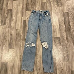 Woman’s straight high rise ripped jeans size large from Abercrombie and fitch.